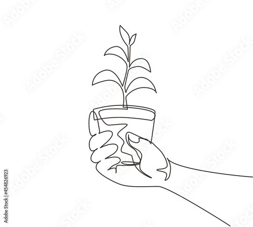 Continuous one line drawing agronomist holding seedlings in peat pots. Female hands touching the plants for planting tree. The spring planting. Single line draw design vector graphic illustration