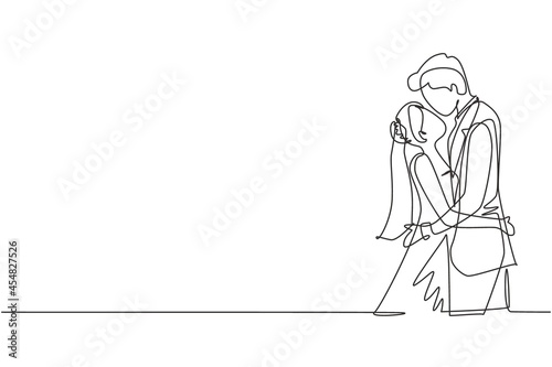 Continuous one line drawing cute married couple in love kissing and hugging. Happy romantic man wearing suit and woman with dress in wedding celebration party. Single line draw design vector graphic