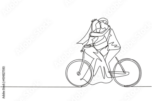 Fototapeta Naklejka Na Ścianę i Meble -  Single one line drawing active married couple riding on bike together. Happy cute enamored man and woman cyclist hugging feeling love wearing wedding dress. Continuous line draw design graphic vector