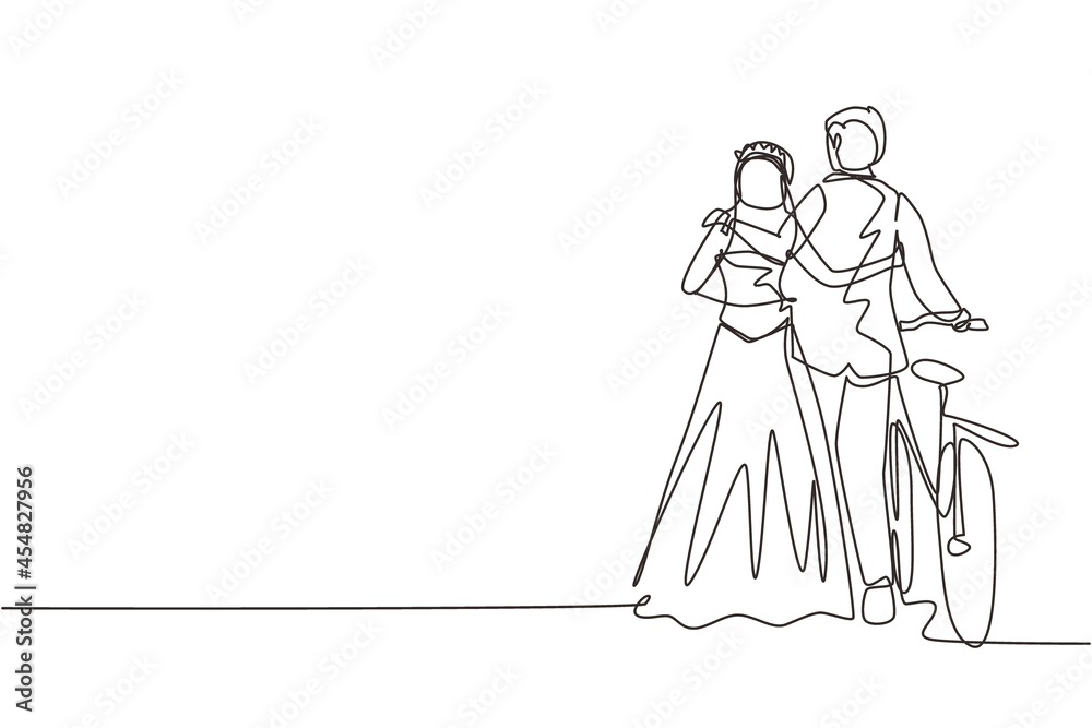 Single one line drawing back view of cute romantic married couple with bicycle walking in park on sunny autumn day. Man and woman in love with wedding dress. Continuous line draw design graphic vector