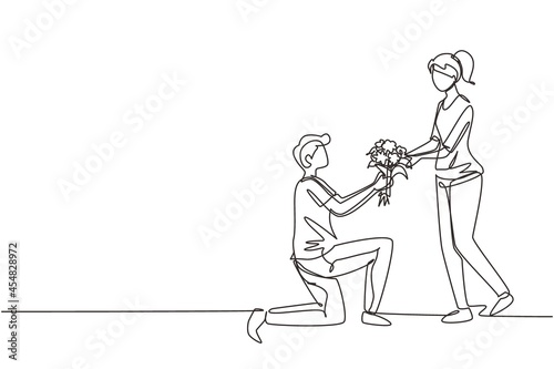 Single one line drawing man on knee making marriage proposal to woman with bouquet. Boy in love giving flowers. Happy couple getting ready for wedding. Continuous line draw design graphic vector