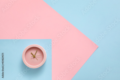 Alarm clock on color backgr...