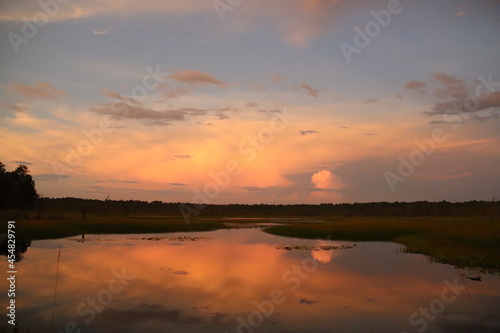 Romantic sunset sunrise on peaceful waters lake © 1wildlifer