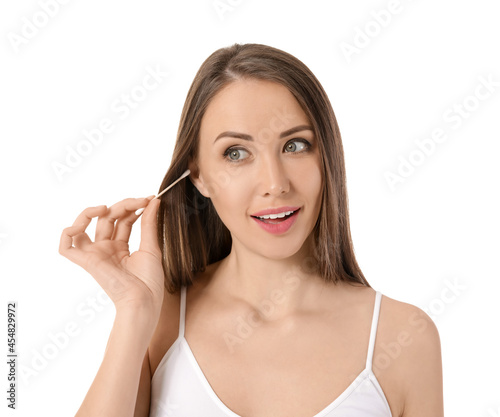Young woman cleaning ears w...