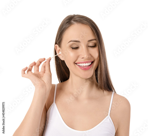 Young woman cleaning ears w...