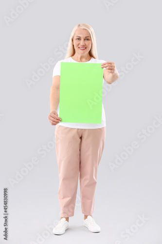 Mature woman with blank pap...