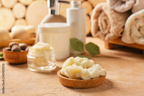 Bowl of shea butter on table