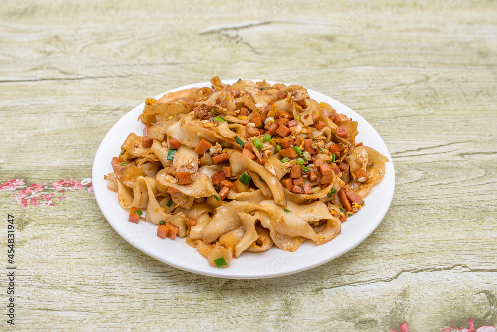 Popular and classic Chinese Sichuan home-cooked dish-fried noodles with ham and egg Popular and classic Chinese Sichuan home-cooked dish-fried noodles with ham and egg