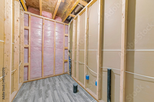 Unfinished bathroom construction with woodframes and wooden flooring