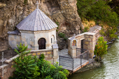 Metekhi Saint Virgin Church river view in Tbilisi old city center at dawn photo