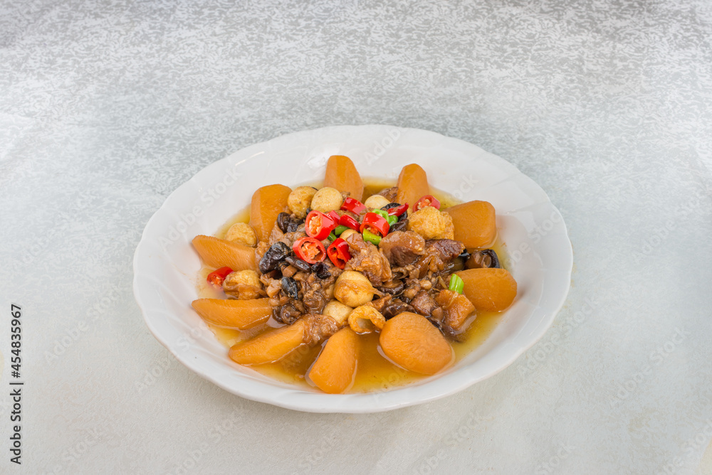 Fototapeta premium A delicious Chinese dish made with radishes, mushrooms and grilled quail eggs