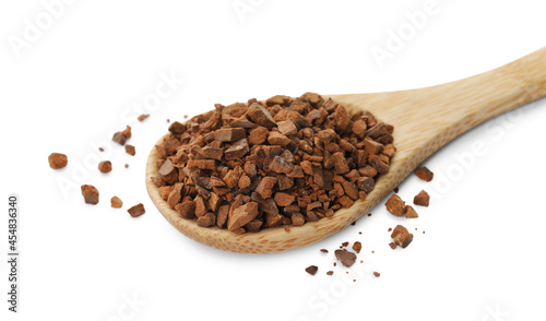 Spoon of chicory granules on white background