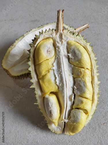 Durian riped and fresh ,durian peel with yellow colour on the table.