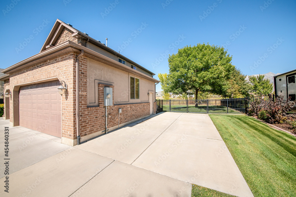 Detached garage exterior with bricks and clipped corner sectional door