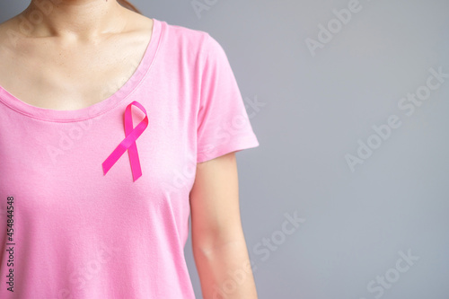 October Breast Cancer Awareness month, elderly Woman in pink T- shirt with Pink Ribbon for supporting people living and illness. International Women, Mother and World cancer day concept