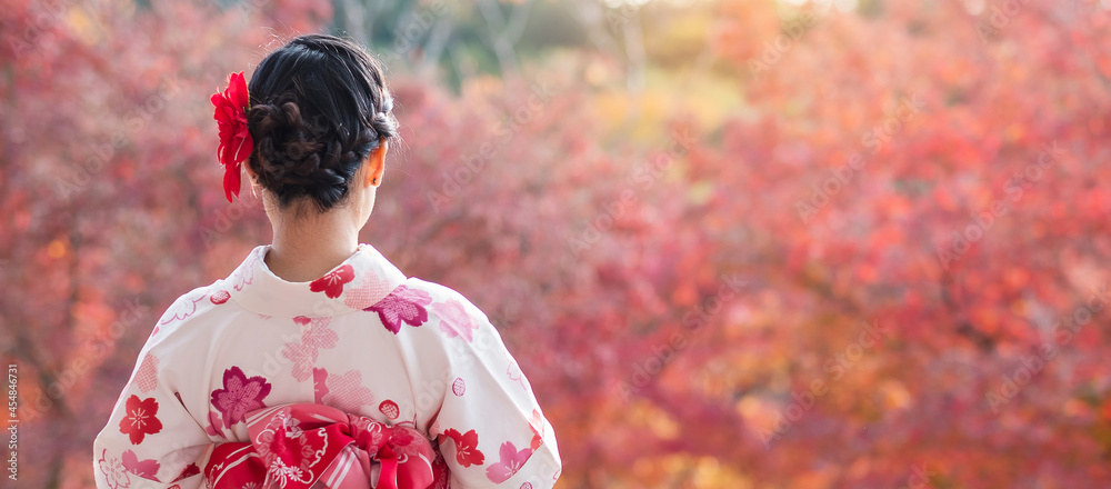 young woman tourist wearing kimono enjoying with colorful leaves in temple,  Kyoto, Japan. Asian girl with hair style in traditional Japanese clothes in  Autumn foliage season Stock Photo | Adobe Stock