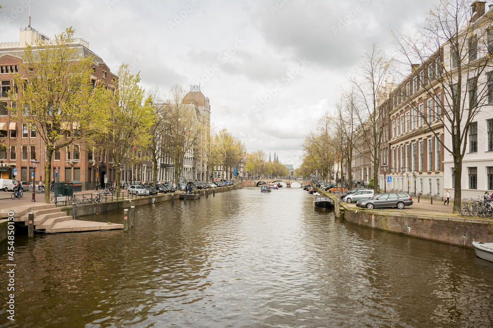 Amsterdam Canal Lined With Historic Buildings
