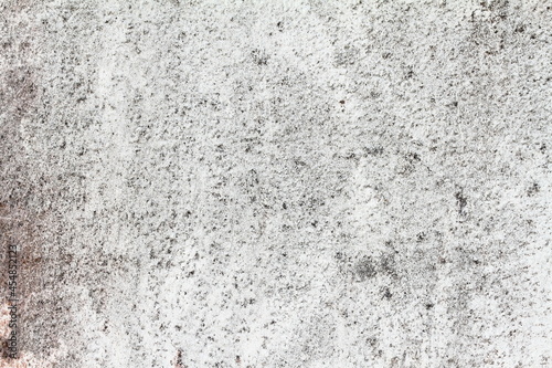 The black and white background plaster walls are old and dirty.