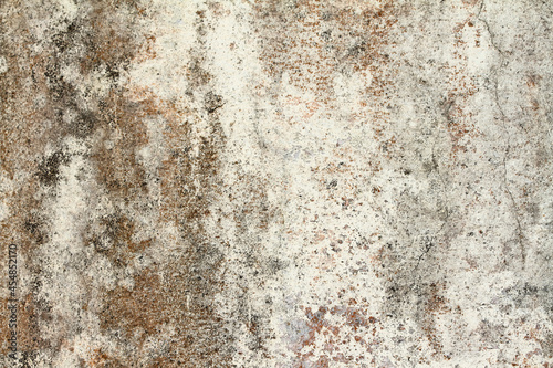 The orange and black background plaster walls are old and dirty