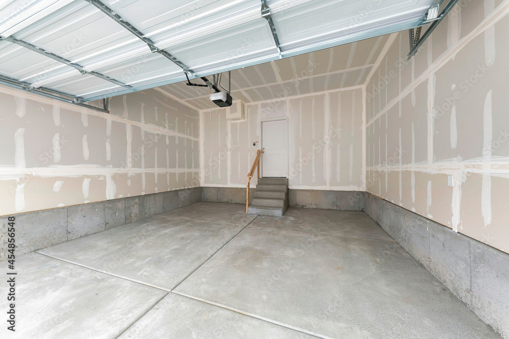 Unfinished garage interior with white markings on the wall Stock Photo Adobe Stock