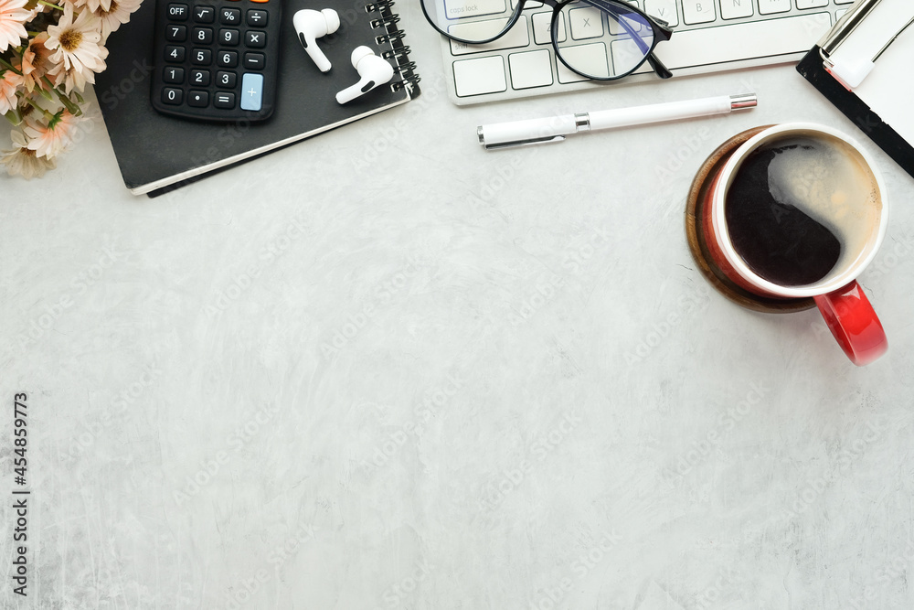 Fototapeta premium Coffee cup, glasses, calculator and notebook on accountant workspace.