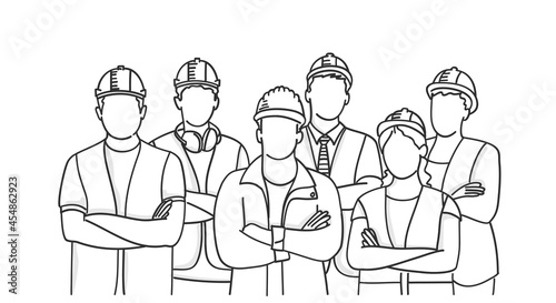 Builder group wearing helmets with arms crossed.