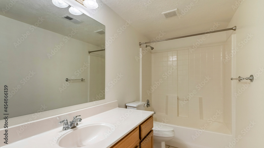 Pano Bathroom interior with long vanity sink and bathtub with shower Pano Bathroom interior with long vanity sink and bathtub with shower