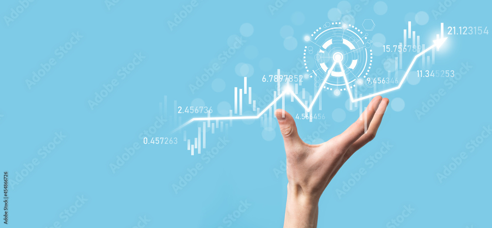 Businessman in hand hold banking business finance graph and invest in stock market investment point,economic growth and investor concept.analysis virtual stock market chart,analyze by use technology Businessman in hand hold banking business finance graph and invest in stock market investment point,economic growth and investor concept.analysis virtual stock market chart,analyze by use technology