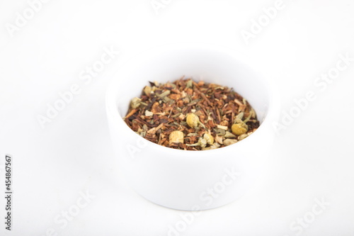 tea leaves for brewing in a white cup