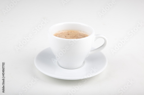 small cup of hot chocolate on a white plate in a white cup