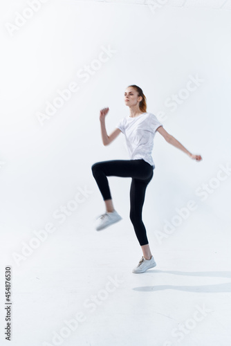 woman in sports uniform big energy lifestyle jumping light background