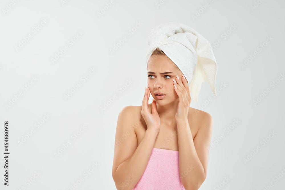 woman with towel on head dermatology skin care close-up woman with towel on head dermatology skin care close-up