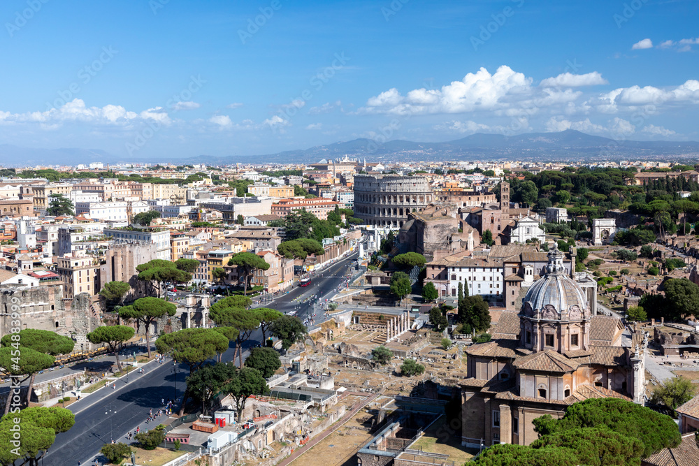 spectacular view to skyline of Rome with colloseum and via dei fori imperiati and roman forum