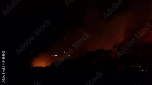 Pisa, Italy. Forest fire at night. Destroyed flora and fauna. Global warming