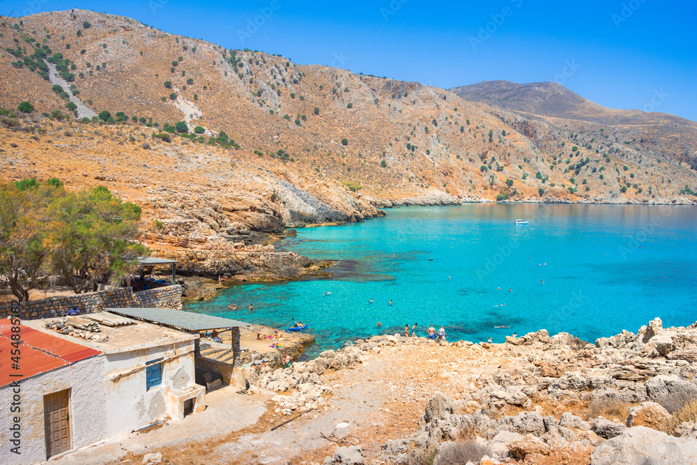 Amazing rocky beach of Ombros Gialos, Chania, Crete, Greece.