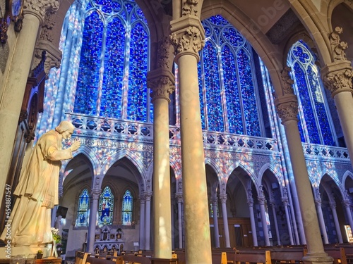 Beautiful interior of the basilica of Pontmain, northern France. Blue Stained glass windows

