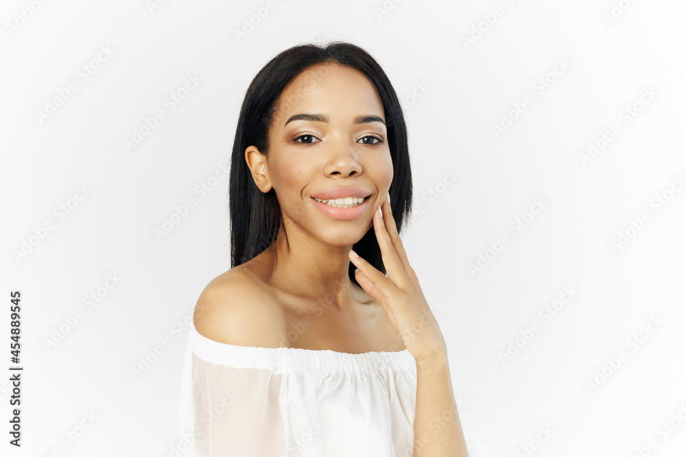 woman african appearance in white dress posing cosmetics luxury light background woman african appearance in white dress posing cosmetics luxury light background