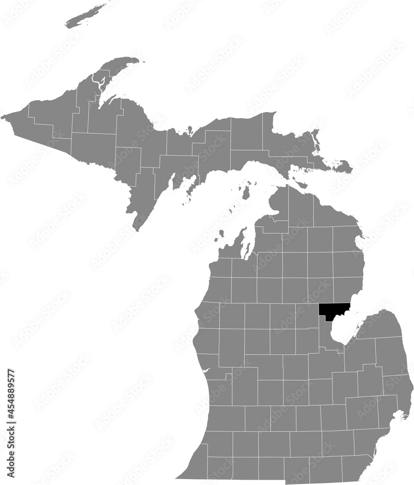 Obraz premium Black highlighted location map of the Arenac County inside gray map of the Federal State of Michigan, USA