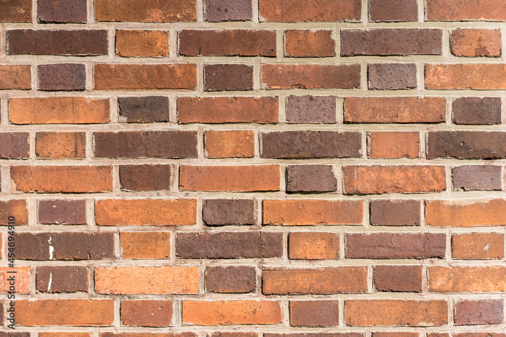 Obraz premium brick red wall. background of a old brick house.