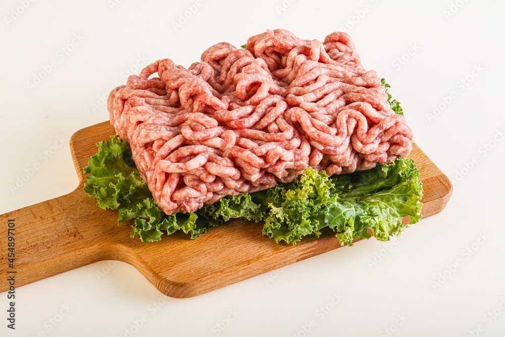 Raw pork minced meat over board Raw pork minced meat over board