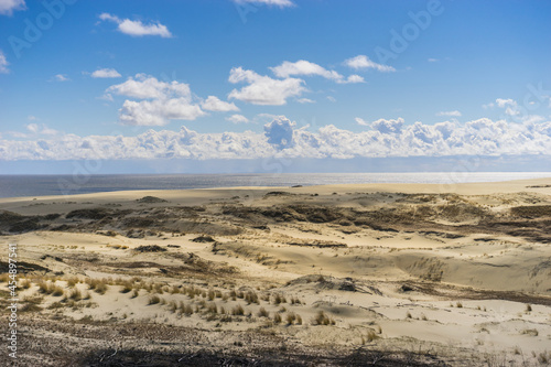 Coast of the Baltic Sea. Sand dunes with clouds. Typical Baltic beach landscape.