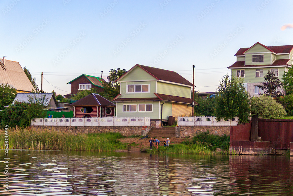 Fototapeta premium Sunset over Lake Seliger. Coastline and promenade