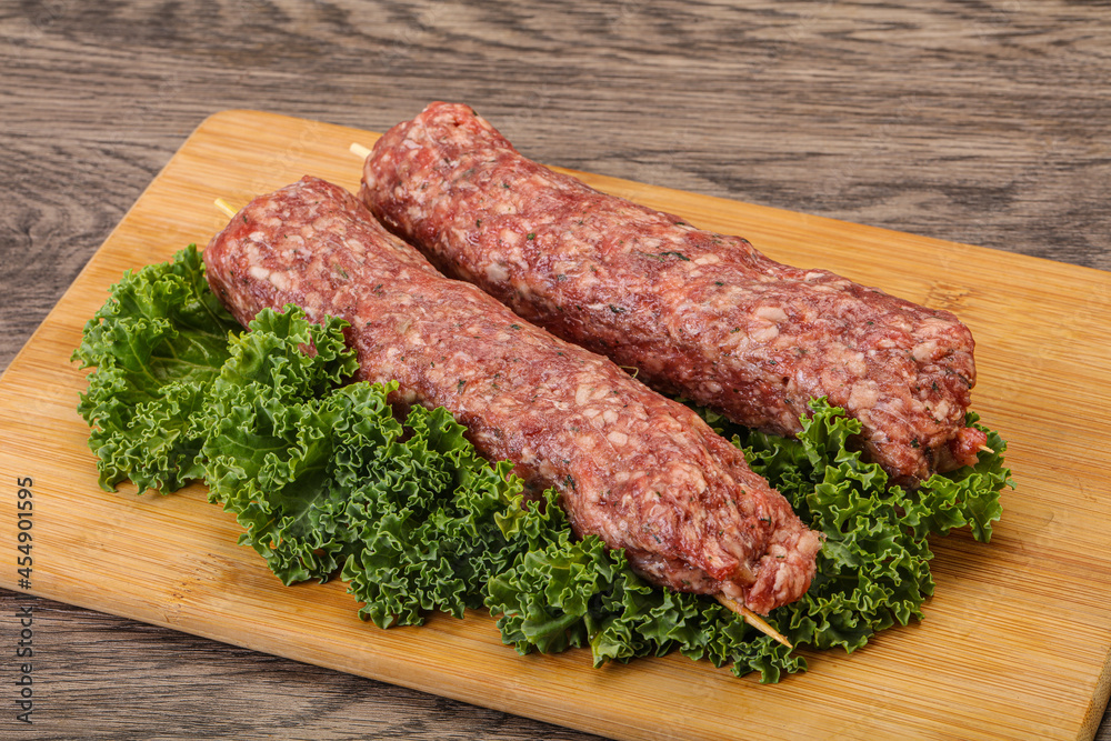 Raw minced beef kebab skewer