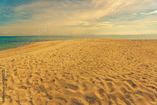 Nature in twilight period which including of sunrise over the sea and the nice beach. Summer beach with blue water and purple sky at the sunset.  