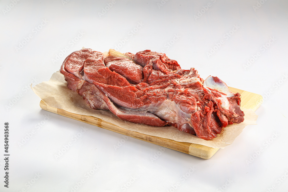 Raw beef meat over board