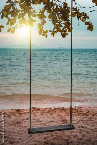 Nature in twilight period which including of sunrise over the sea and the nice beach. Summer beach with blue water and purple sky at the sunset.