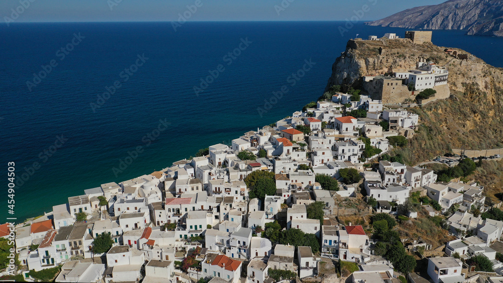 Obraz premium Aerial drone photo of breathtaking and picturesque main village of Skyros island featuring uphill medieval castle with scenic views to Aegean sea at sunset, Sporades islands, Greece
