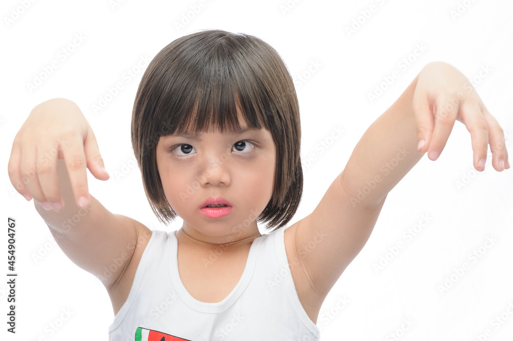 Happy asian kid on Halloween. A cute girl with black eyeliner put her hand up to make a scary expression and show emotion on her face with white background. Happy asian kid on Halloween. A cute girl with black eyeliner put her hand up to make a scary expression and show emotion on her face with white background.