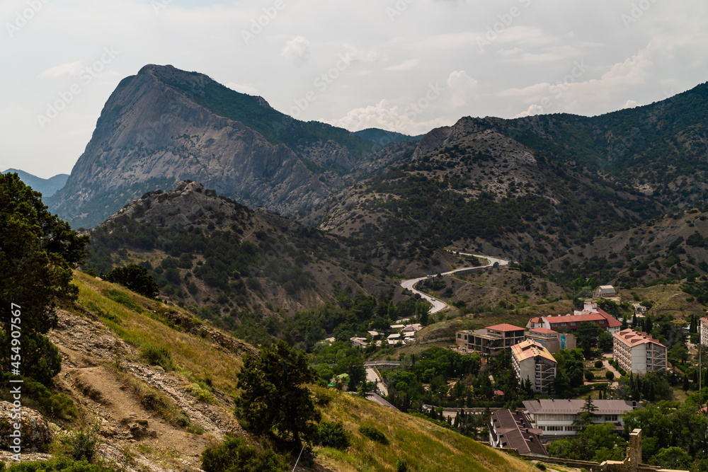 The Republic of Crimea. July 15, 2021. View of the Falcon Mountain from the Genoese fortress in the city of Sudak.