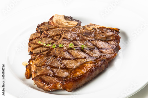 grilled beef fillet steak meat with rosemary isolated on white background